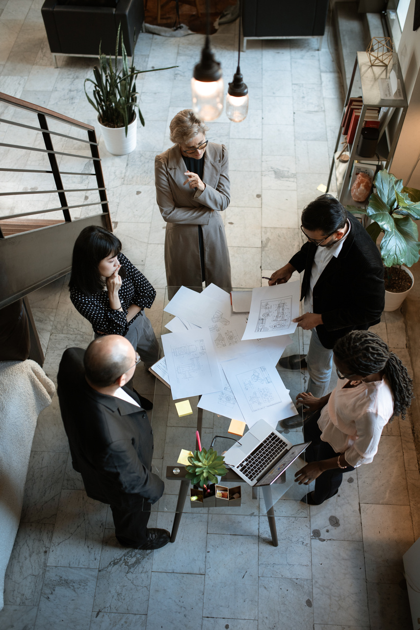 People Sitting on Chair in Front of Table